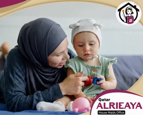 Qatar Nanny Maid 051898847 alrieaya Caring nanny in Qatar supporting a baby with playtime at home.